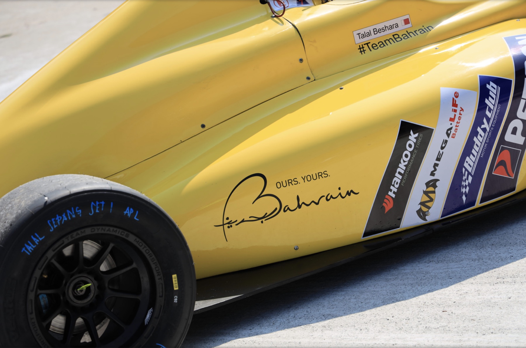 Sidepod of Talal's Formula 4 car with Ours. Yours. Bahrain branding